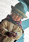 Yolanda, in traditional dress, working as a photo model for tourists in Cusco, Peru